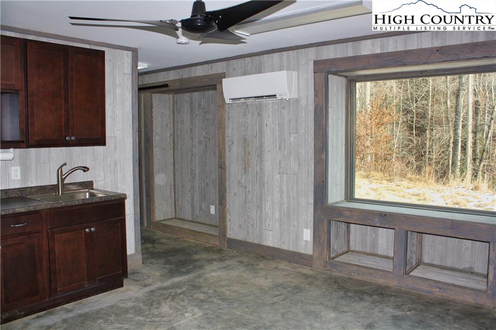 1520 Meadow Road Ferguson, NC 28624 - Photo 6 of 44 a view of an empty room with a window