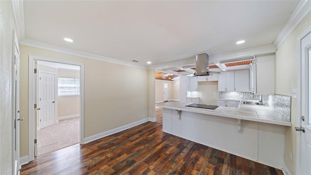 539 Edmonson Avenue Athens, TX 75751 - Photo 7 of 21 a kitchen with kitchen island a sink appliances and cabinets