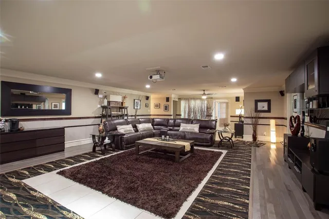 a large room with lots of furniture and a rug