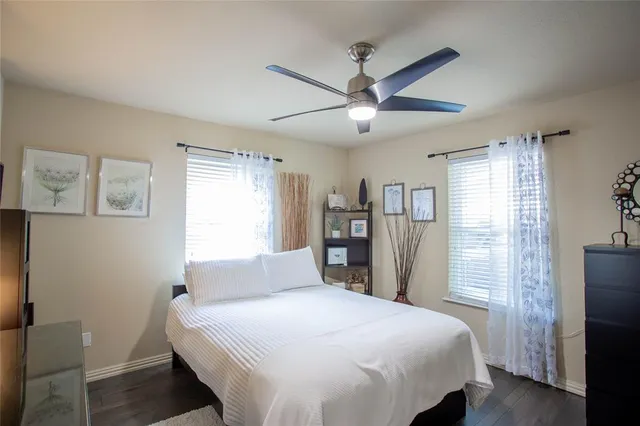 a bedroom with a large bed and a window