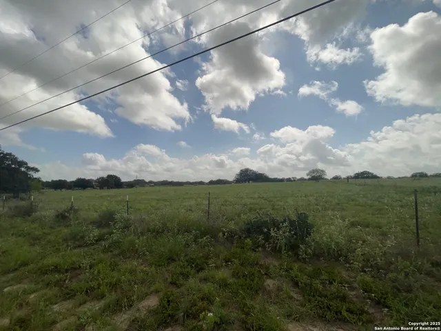 a view of outdoor space with deck and yard