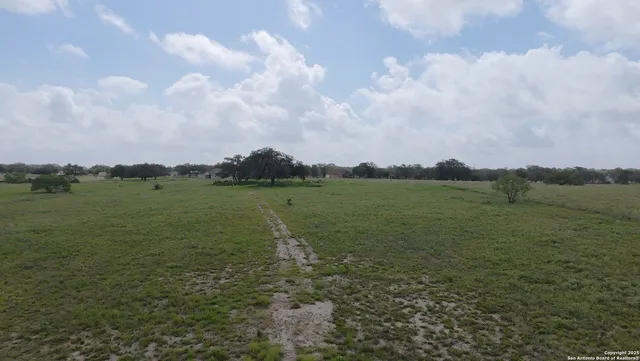 a view of a lake with houses in the back