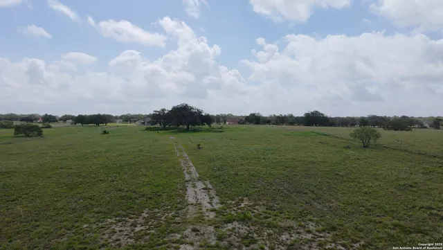 a view of a lake with houses in the back