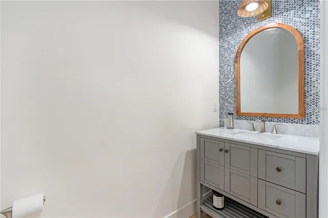 a bathroom with a double vanity sink and a mirror