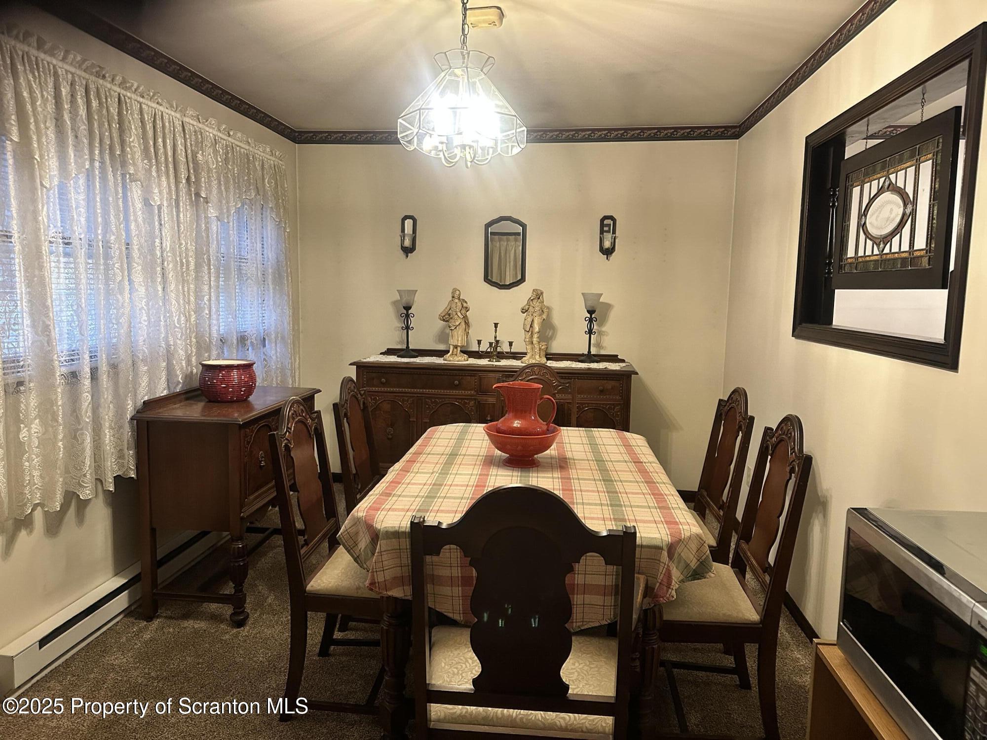 55 Yorktown Road Mountain Top, PA 18707 - Photo 14 of 32 a view of a dining room with furniture and chandelier