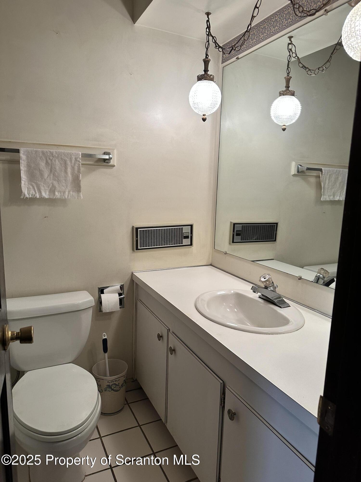 55 Yorktown Road Mountain Top, PA 18707 - Photo 22 of 32 a bathroom with a toilet sink and mirror