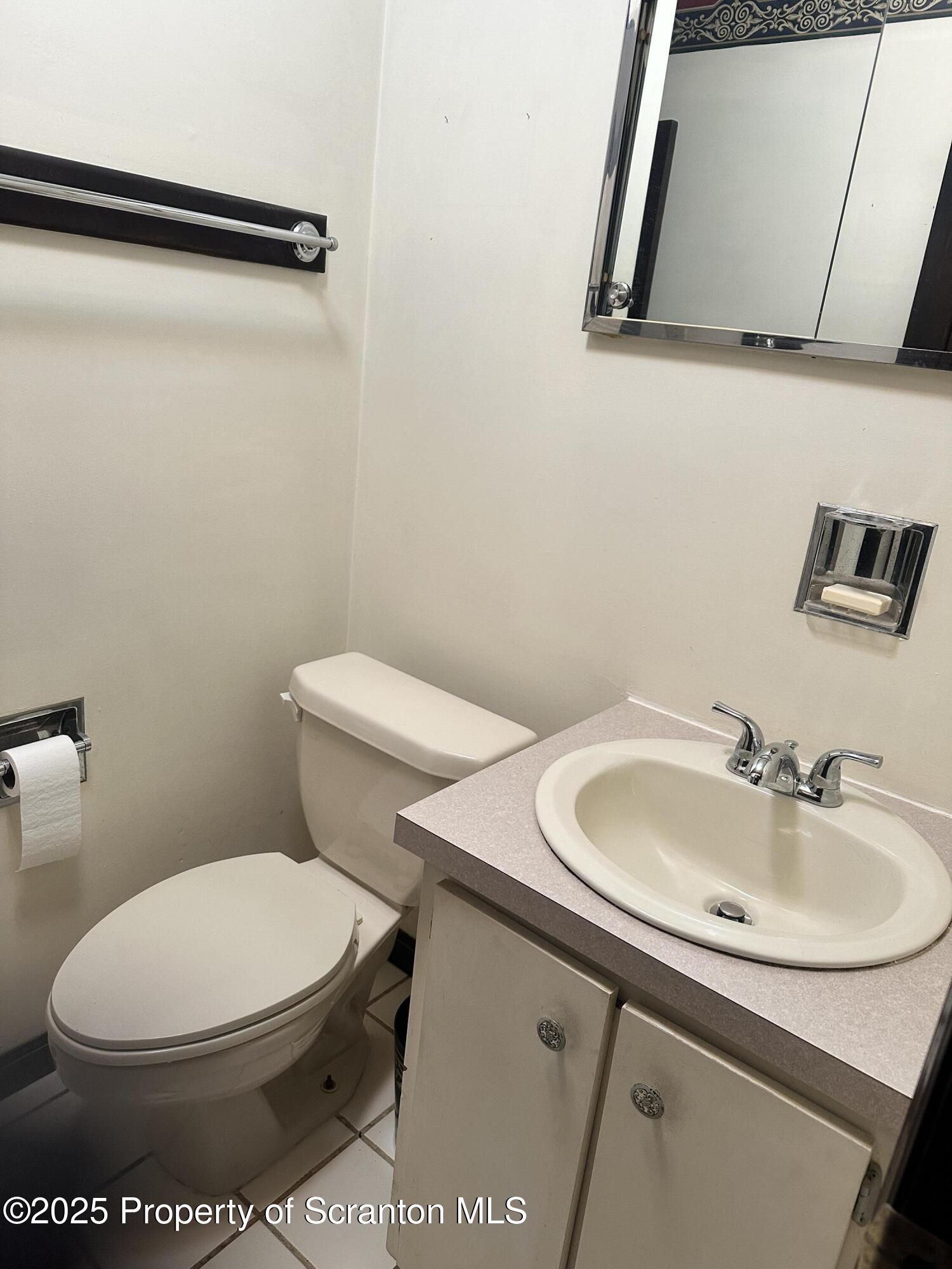 55 Yorktown Road Mountain Top, PA 18707 - Photo 23 of 32 a white toilet sitting next to a bathroom sink