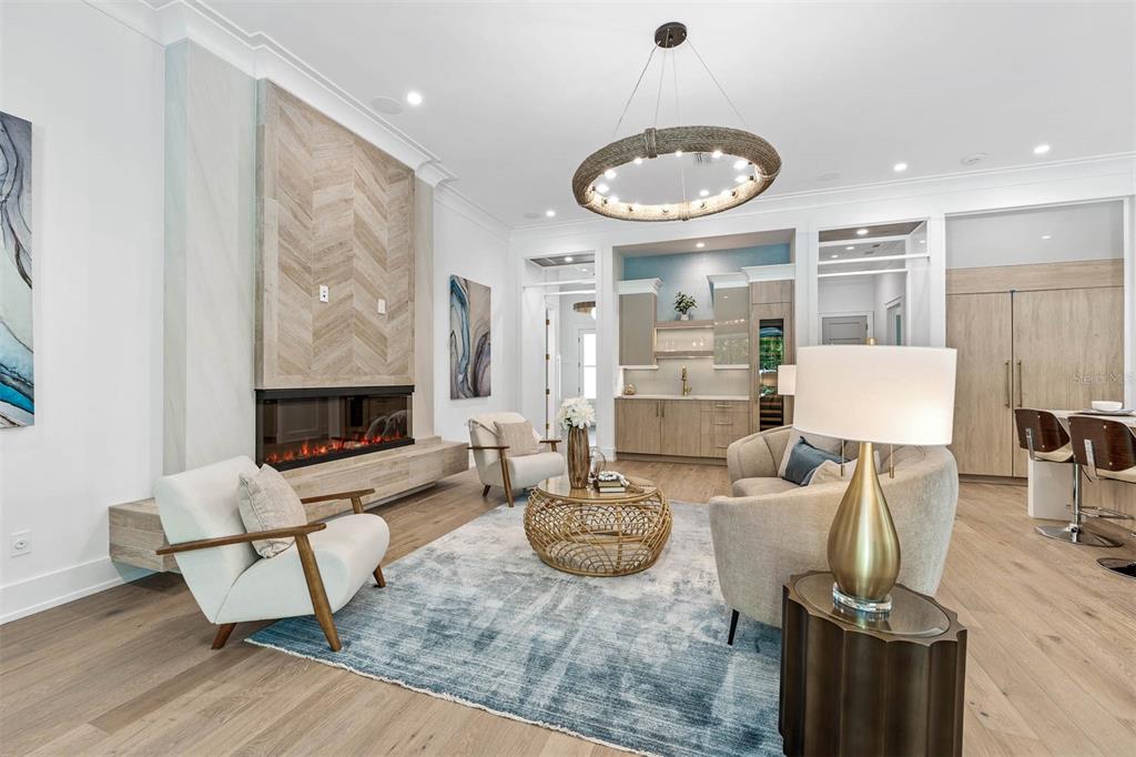 1820 Glencoe Road Winter Park, FL 32789 - Photo 12 of 75 a living room with furniture a fireplace and a flat screen tv