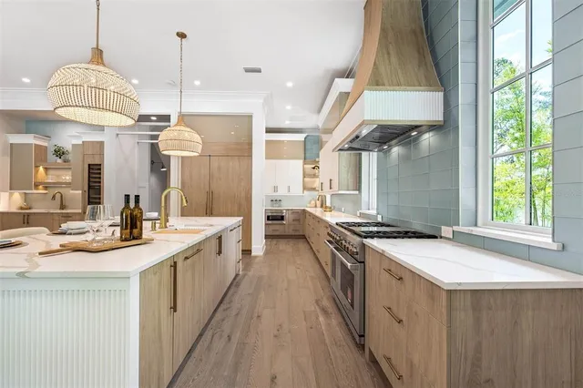 a view of a hallway with wooden floor and glass door