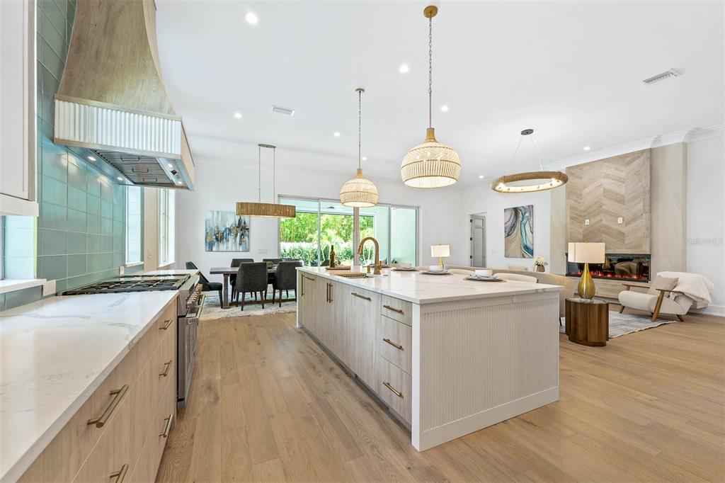 1820 Glencoe Road Winter Park, FL 32789 - Photo 21 of 75 a large kitchen with kitchen island a large counter space a sink appliances and a large window