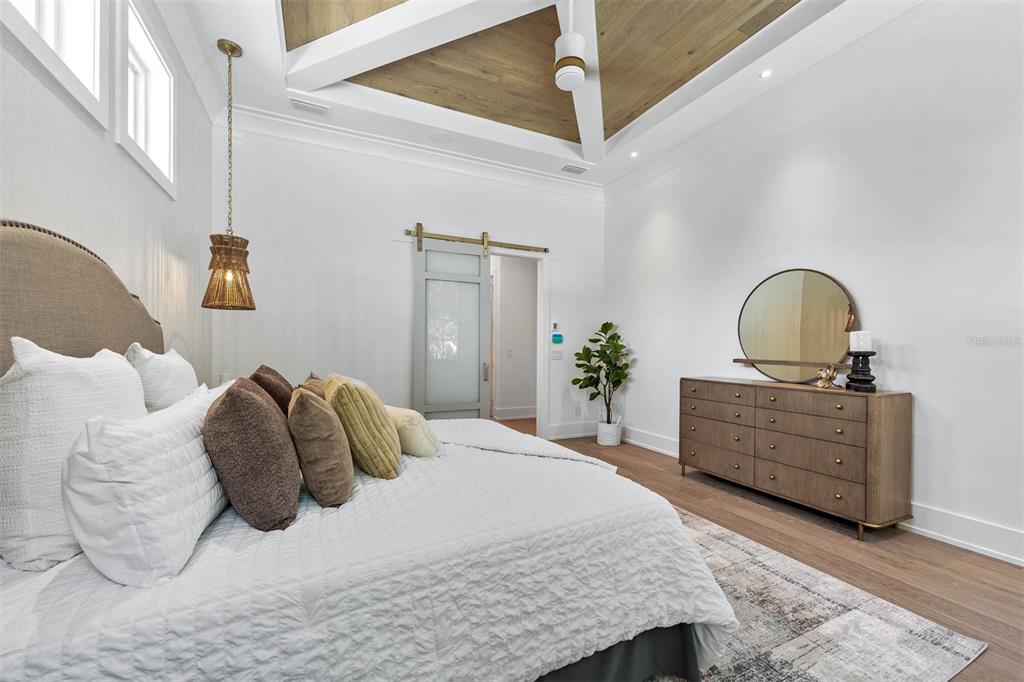 1820 Glencoe Road Winter Park, FL 32789 - Photo 25 of 75 a bedroom with a bed potted plant with the dresser and mirror