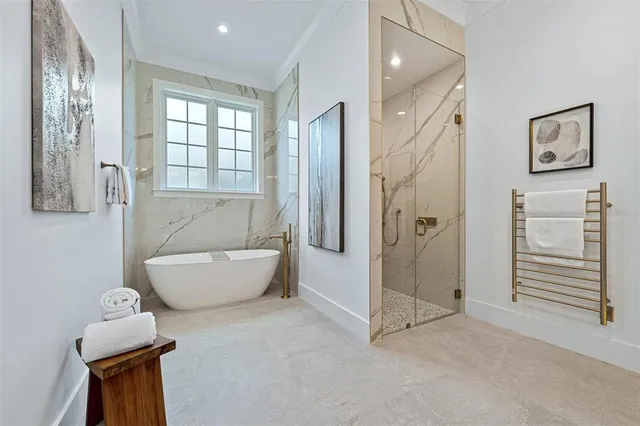 an empty room with wooden floor cabinet and windows