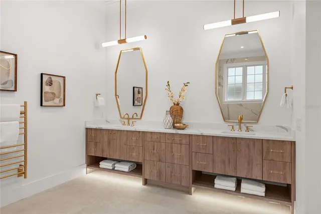 a bathroom with a sink toilet vanity and shower