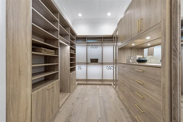 a bathroom with a shower sink vanity mirror and toilet