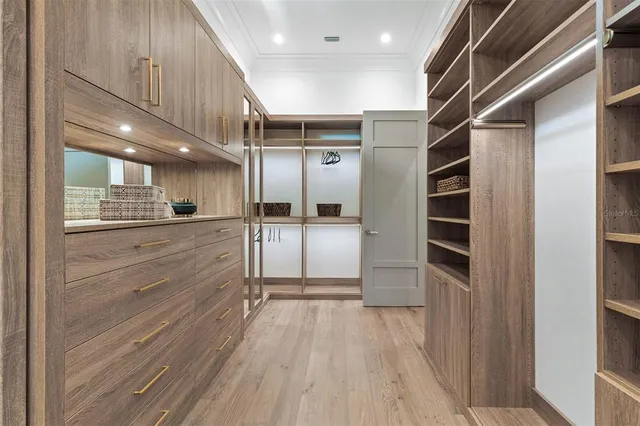 a room with walk in closet and a window