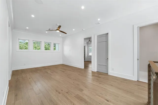 a bathroom with a granite countertop sink a toilet and mirror