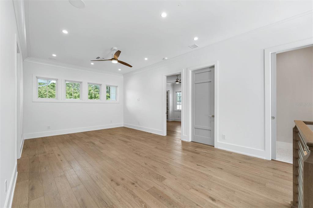 1820 Glencoe Road Winter Park, FL 32789 - Photo 38 of 75 a view of an empty room with wooden floor and a window