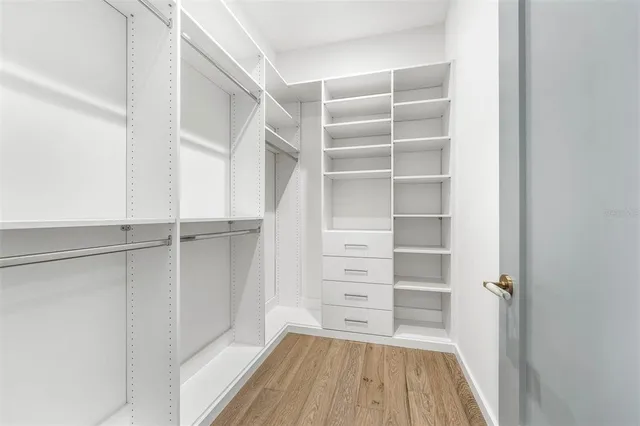 an aerial view of a house with garden space and street view