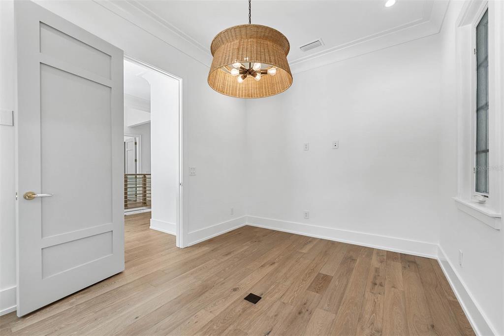 1820 Glencoe Road Winter Park, FL 32789 - Photo 49 of 75 an empty room with wooden floor and windows