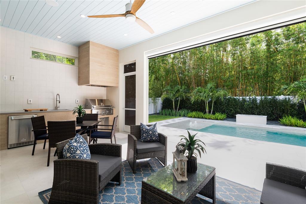 1820 Glencoe Road Winter Park, FL 32789 - Photo 53 of 75 a living room with patio furniture and a floor to ceiling window