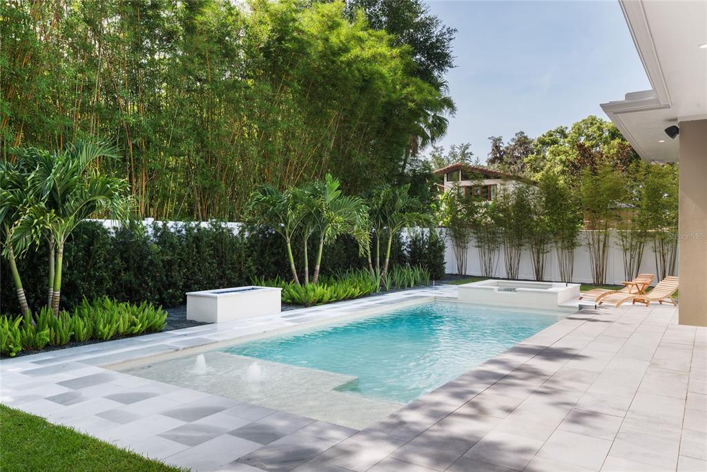 1820 Glencoe Road Winter Park, FL 32789 - Photo 63 of 75 a view of a yard with plants and a large tree
