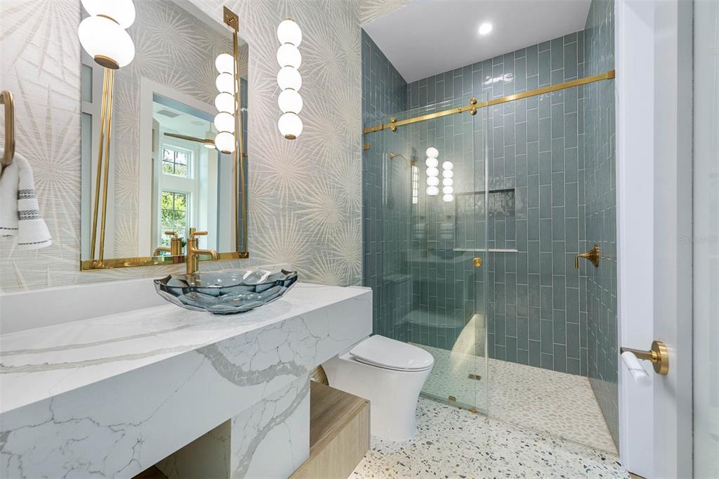 1820 Glencoe Road Winter Park, FL 32789 - Photo 8 of 75 a bathroom with a sink a toilet a mirror and shower