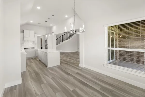 a view of a living room and kitchen view