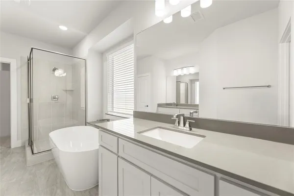 a bathroom with a sink a toilet a mirror and vanity