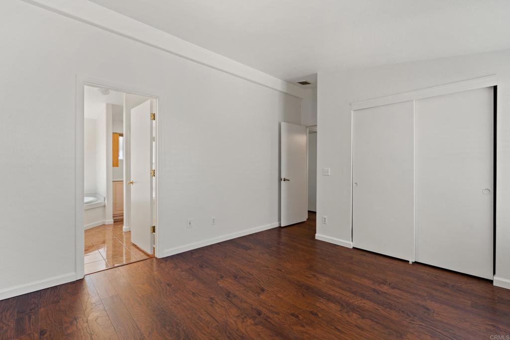 13125 Alpine Drive, Unit 212 Poway, CA 92064 - Photo 11 of 22 a view of an empty room with wooden floor