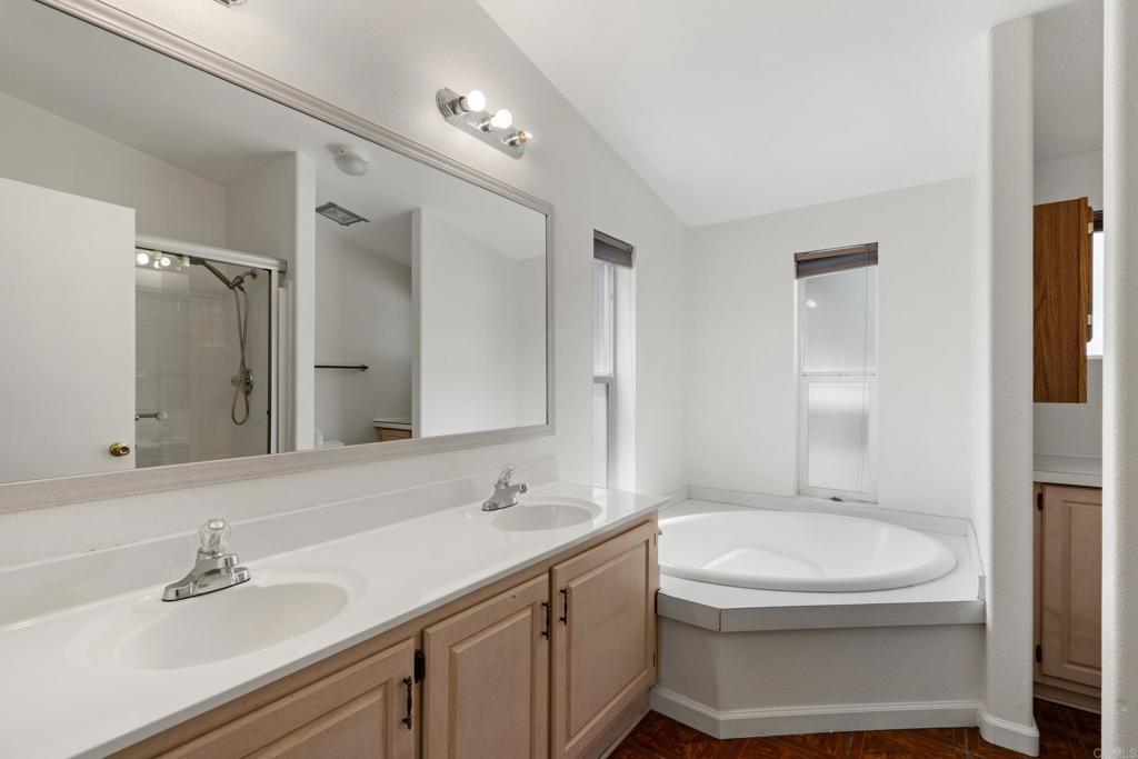 13125 Alpine Drive, Unit 212 Poway, CA 92064 - Photo 13 of 22 a bathroom with a sink a toilet and shower