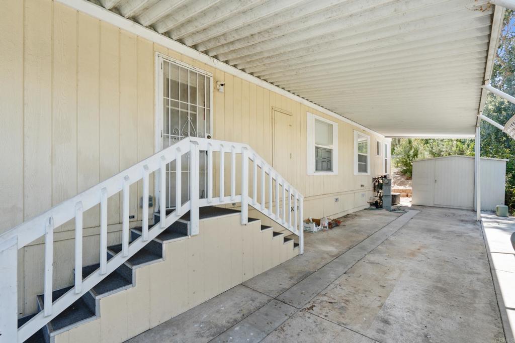 13125 Alpine Drive, Unit 212 Poway, CA 92064 - Photo 20 of 22 a view of staircase with white walls and a window