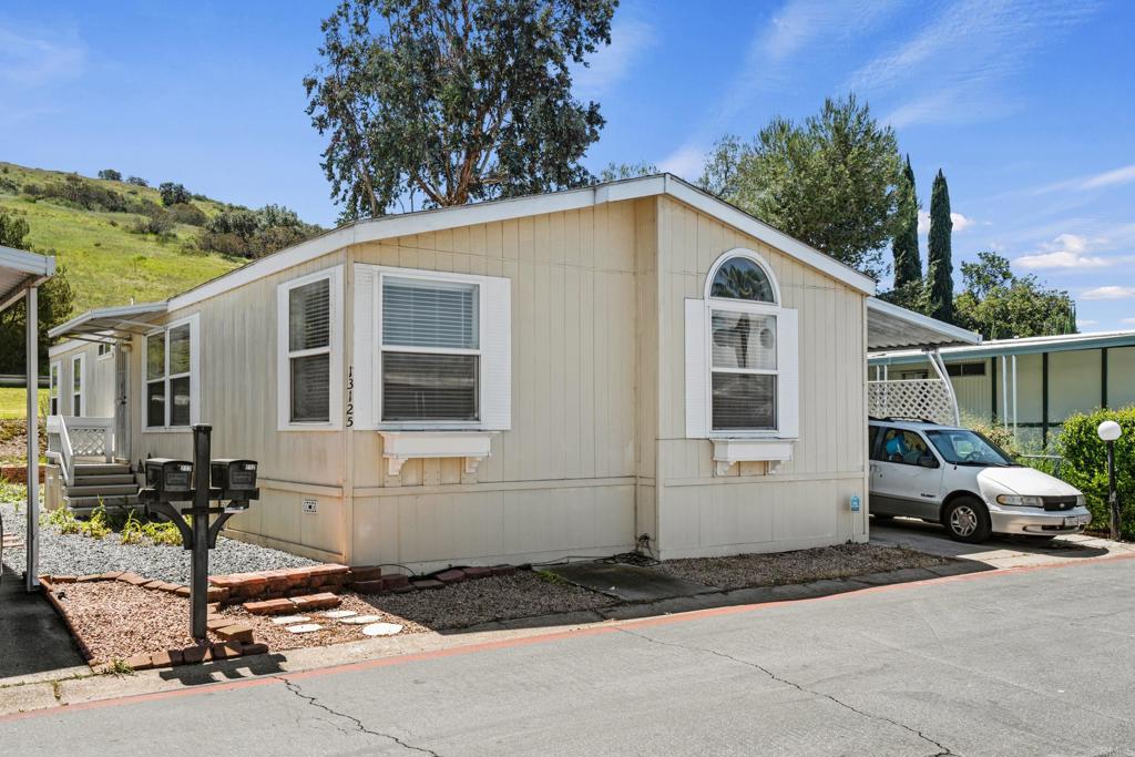 13125 Alpine Drive, Unit 212 Poway, CA 92064 - Photo 22 of 22 a front view of a house with a yard