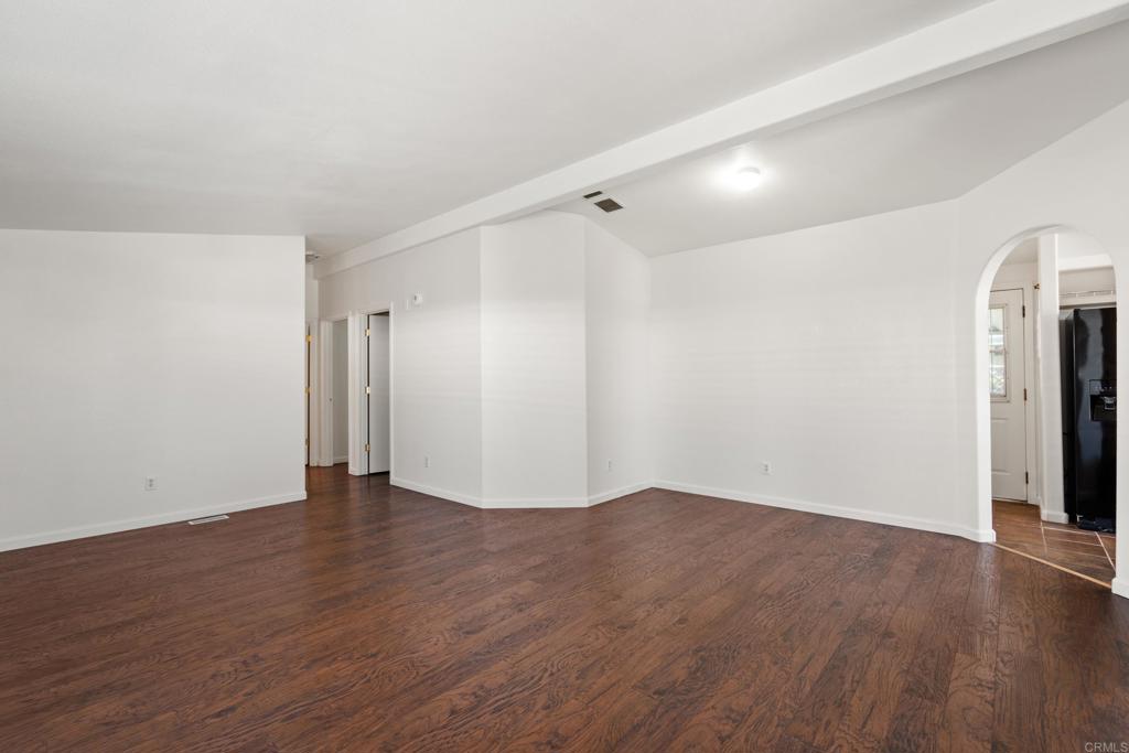 13125 Alpine Drive, Unit 212 Poway, CA 92064 - Photo 9 of 22 a view of an empty room with wooden floor
