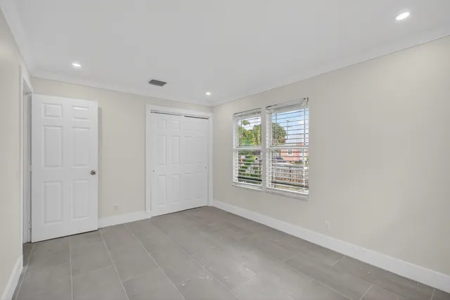 a view of an empty room with a window