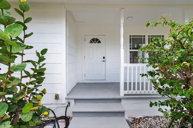 a view of balcony with potted plants