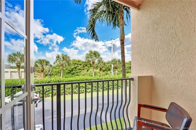 a view of a balcony with wooden floor