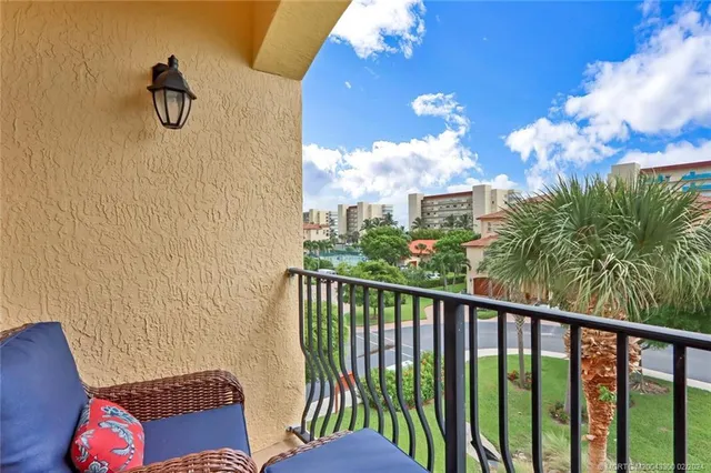 a view of balcony with furniture