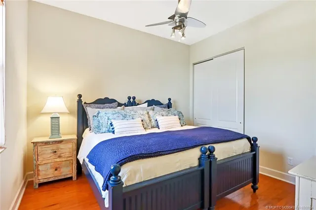 a bed room with a bed and a chandelier