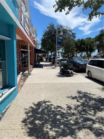 a view of street with parked cars