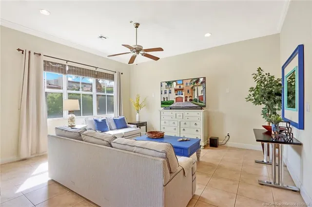 a work room with furniture and potted plants