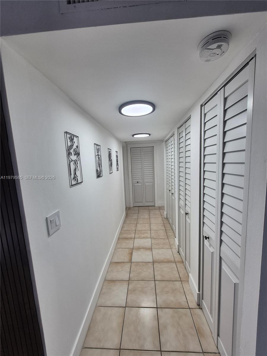 8405 Northwest 8th Street, Unit 304 Miami, FL 33126 - Photo 14 of 24 a view of a hallway