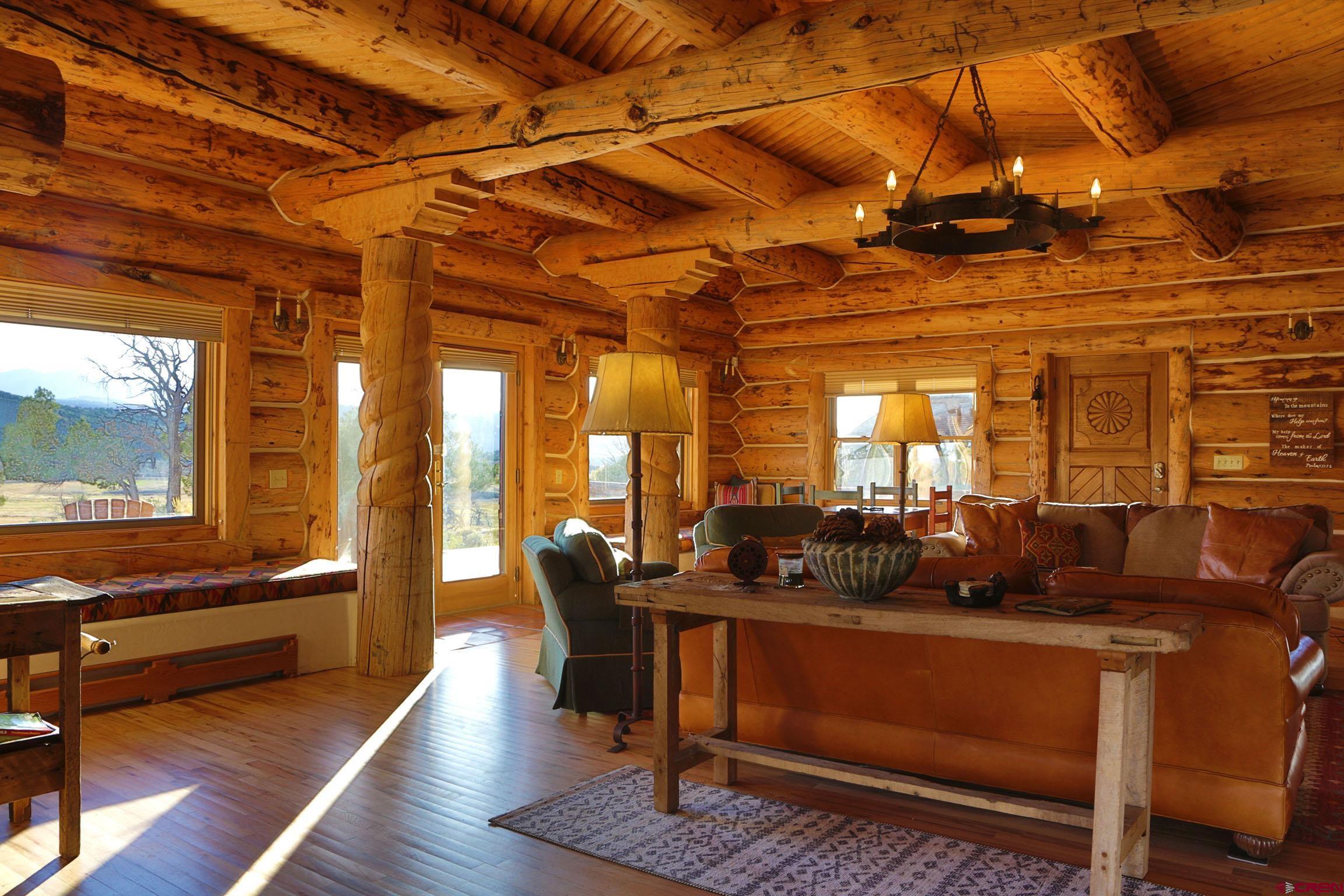 950 County Road 10 Ridgway, CO 81432 - Photo 12 of 32 a living room with furniture a wooden floor and next to a window