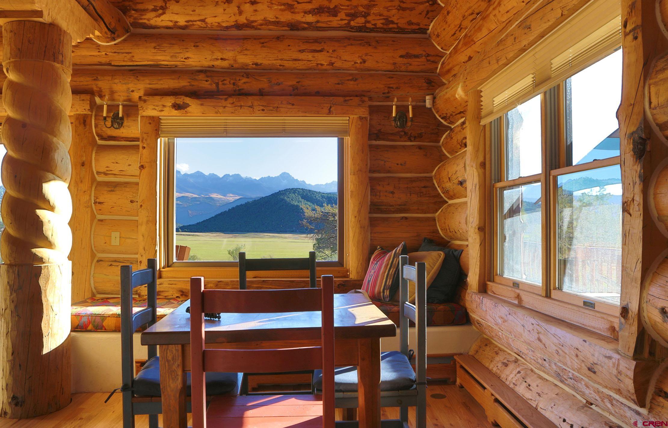 950 County Road 10 Ridgway, CO 81432 - Photo 14 of 32 a dining room with furniture and a window