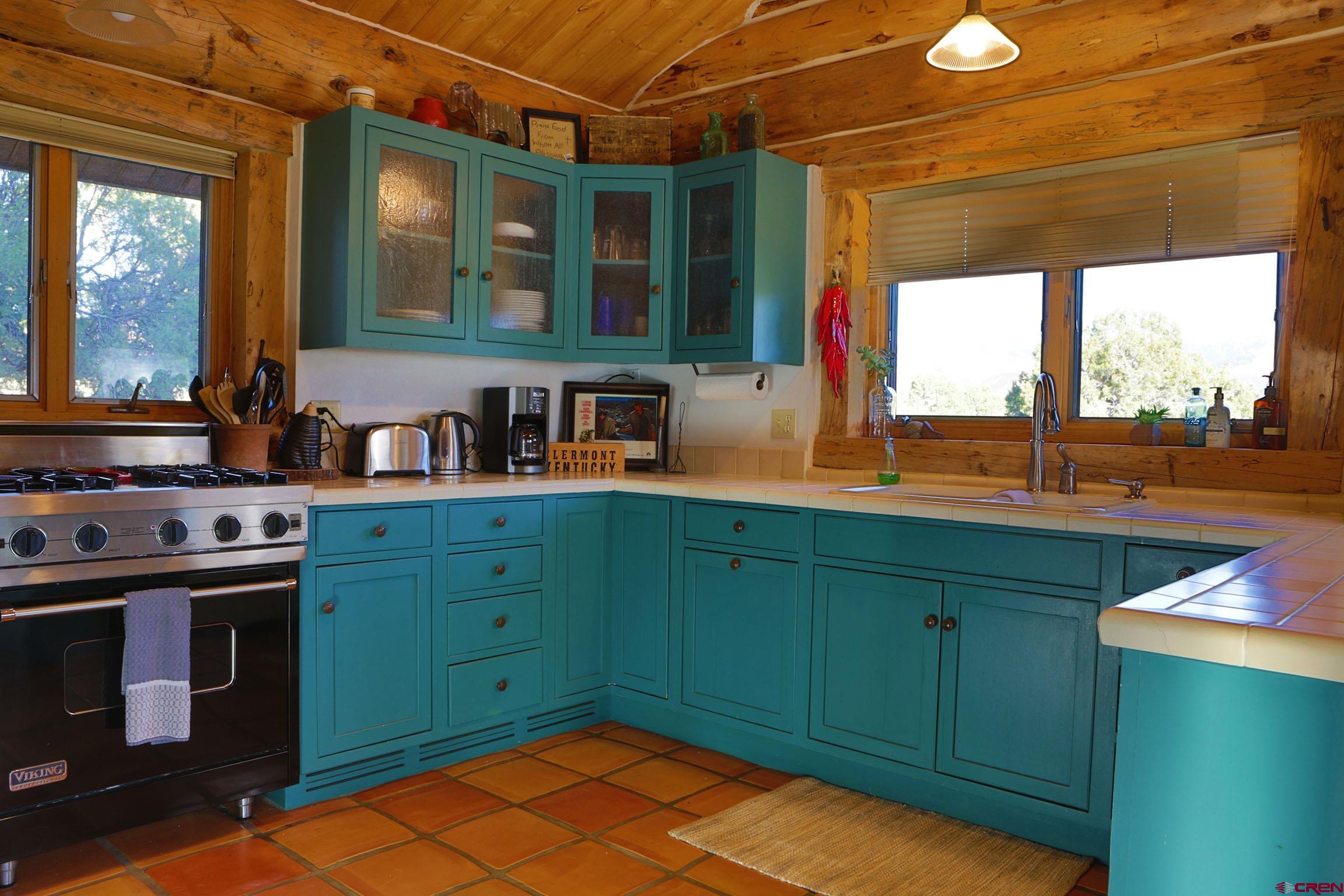 950 County Road 10 Ridgway, CO 81432 - Photo 19 of 32 a kitchen with lots of counter top space and a sink