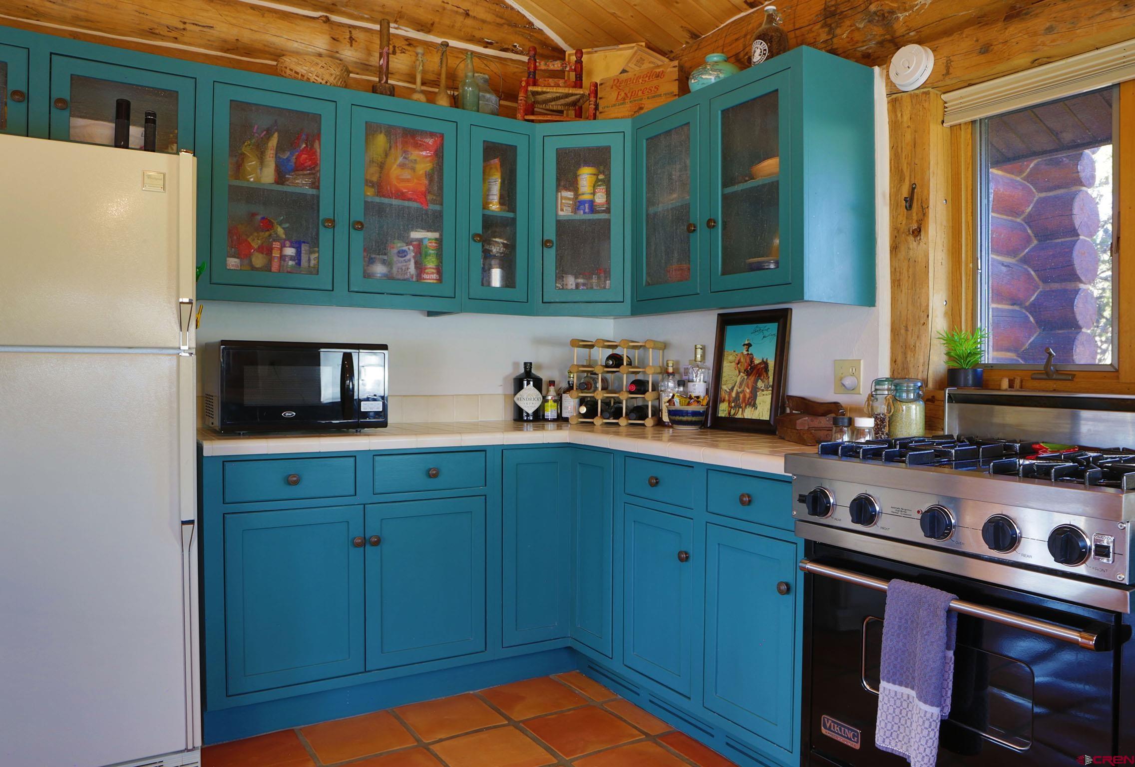 950 County Road 10 Ridgway, CO 81432 - Photo 20 of 32 a kitchen with stainless steel appliances granite countertop a refrigerator and a stove top oven
