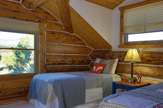 a bed room with a bed and a window