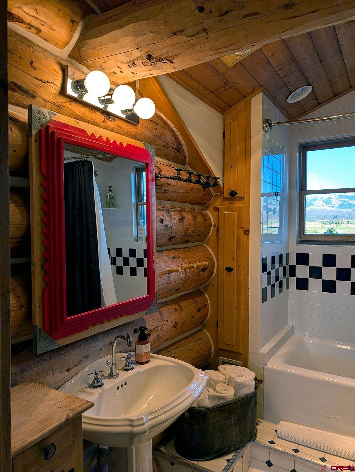 950 County Road 10 Ridgway, CO 81432 - Photo 31 of 32 a bathroom with a sink and a mirror