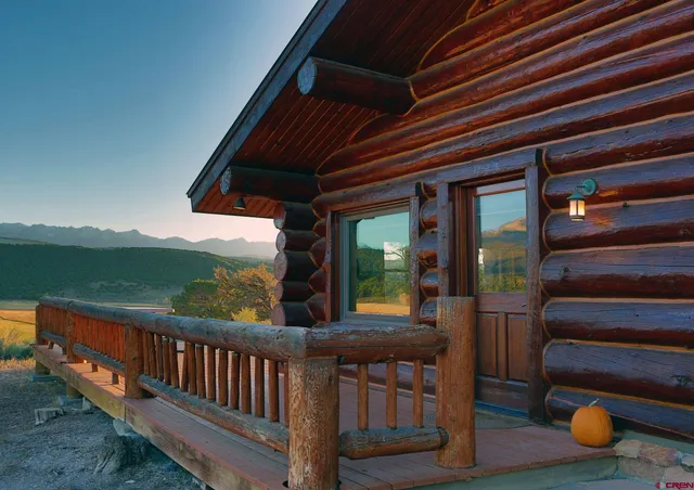 a view of a two chairs in the balcony