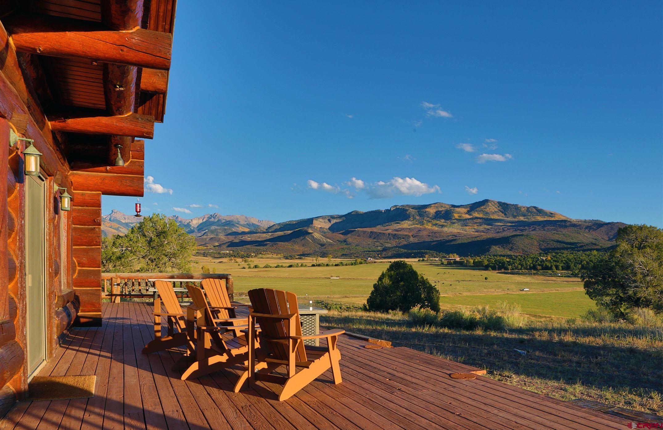 950 County Road 10 Ridgway, CO 81432 - Photo 7 of 32 an outdoor space with wooden floor and city view