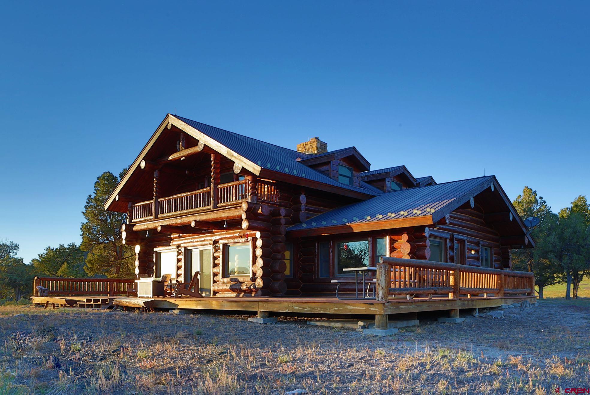 950 County Road 10 Ridgway, CO 81432 - Photo 9 of 32 a view of a house with a yard and balcony